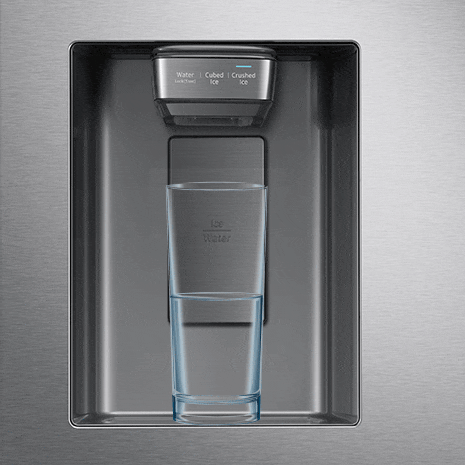 Blue water droplets fill up glass sitting under dispenser