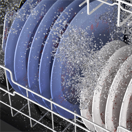 Interior left-facing image of dishwasher with blue and white plates with water flowing