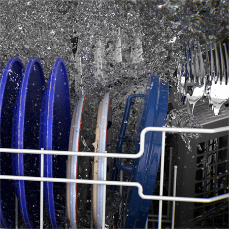 Interior head-on image of dishwasher with blue plates, silverware and water flowing