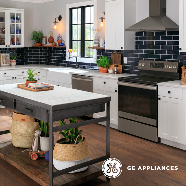 Kitchen with white cabinets, island and Slate GE products, GE Appliances logo in bottom right corner