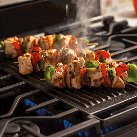 Grill with chicken skewers and griddle with grilled cheese sandwiches. Grill with chicken skewers and griddle with grilled cheese sandwiches.