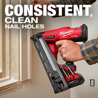 Man uses cordless finish nailer with one hand to drive nails sub flush on window trim.
