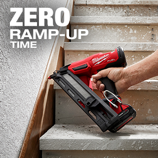 Man uses Milwaukee M18 FUEL finish nailer to attach stair baseboard.