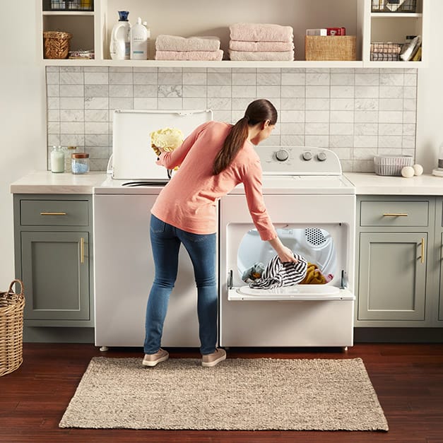 Easily transfer loads to the dryer with a hamper door.