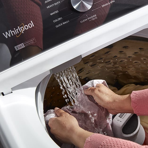 Prewash clothes in the washer with the Built-In Water Faucet.