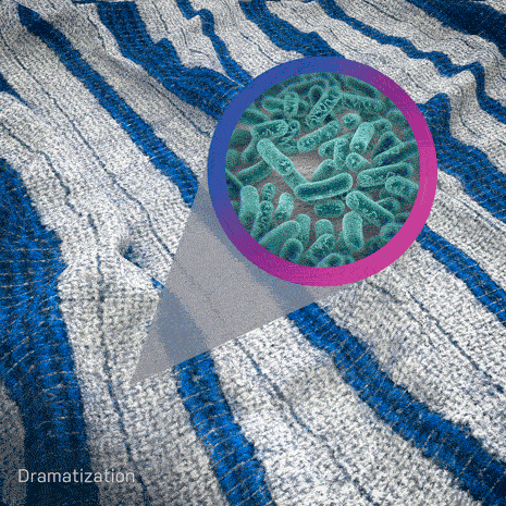An animation of  bacteria being eliminated superimposed over fabric being dried.