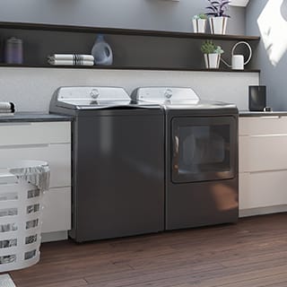 A shot of a laundry room. The appliances are installed between counters.