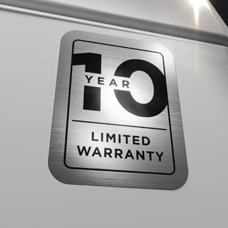 A close up of a sticker on the appliance, showing its 10 year warranty.