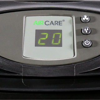 Close up of the AIRCARE Valiant evaporative humidifier control panel with green lights