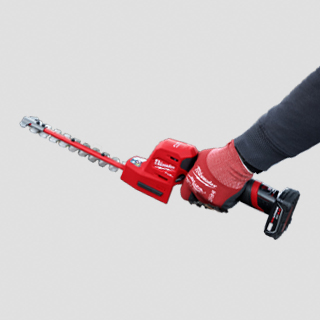 Worker displaying the M12 FUEL 8 Inch Hedge Trimmer