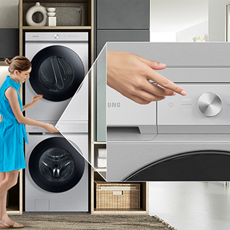 Person reaching for the dryer control panel on stacked washer and dryer. Includes a close-up of the control panel.]