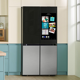 Image of refrigetator in kitchen, with the doors on top shown in black and the doors on the bottom shown in stainless steel.