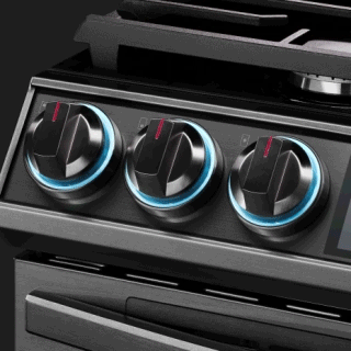 Front panel of gas range with knobs for range control highlighted with a circle of blue.