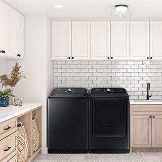 Black washer and dryer shown next to each other in laundry room.