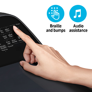 Hand pressing buttons on dryer panel with icons reading "Braille and bumps" and "Audio assistance."