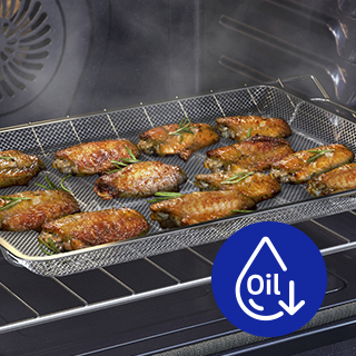 Food on tray in oven. Overlayed with blue icon with the word "oil" and an image of an oil droplet and a down arrow.