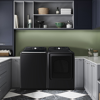 Black washer and dryer shown next to each other in laundry room.