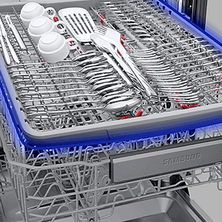 Image showing 3rd rack at the top of inside the dishwasher, holding utensils.