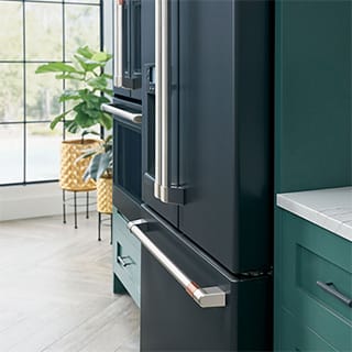 An installed fridge is flush with the surrounding cabinets, creating a seamless look.