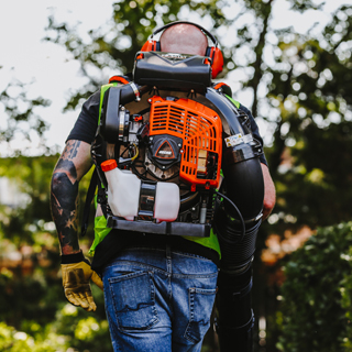 Back of man with ECHO backpack blower