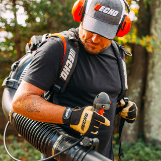 Man with ECHO backpack blower on