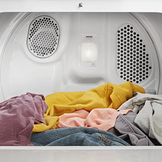 Open and Loaded Whirlpool Dryer with interior light
