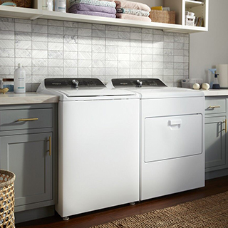 White Whirlpool Washer and Dryer Set in a Modern room