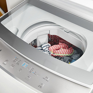 See Through Lid on a White Top Load Whirlpool Washer