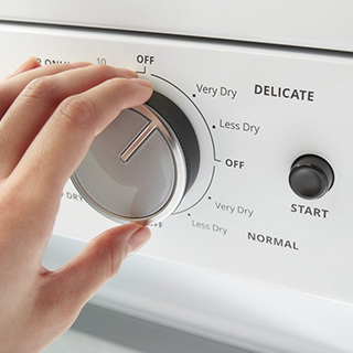 Person choosing Very Dry Option on a Whirlpool Dryer