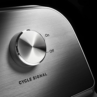 Control panel of a washing machine: buttons and dials for selecting settings and cycles.